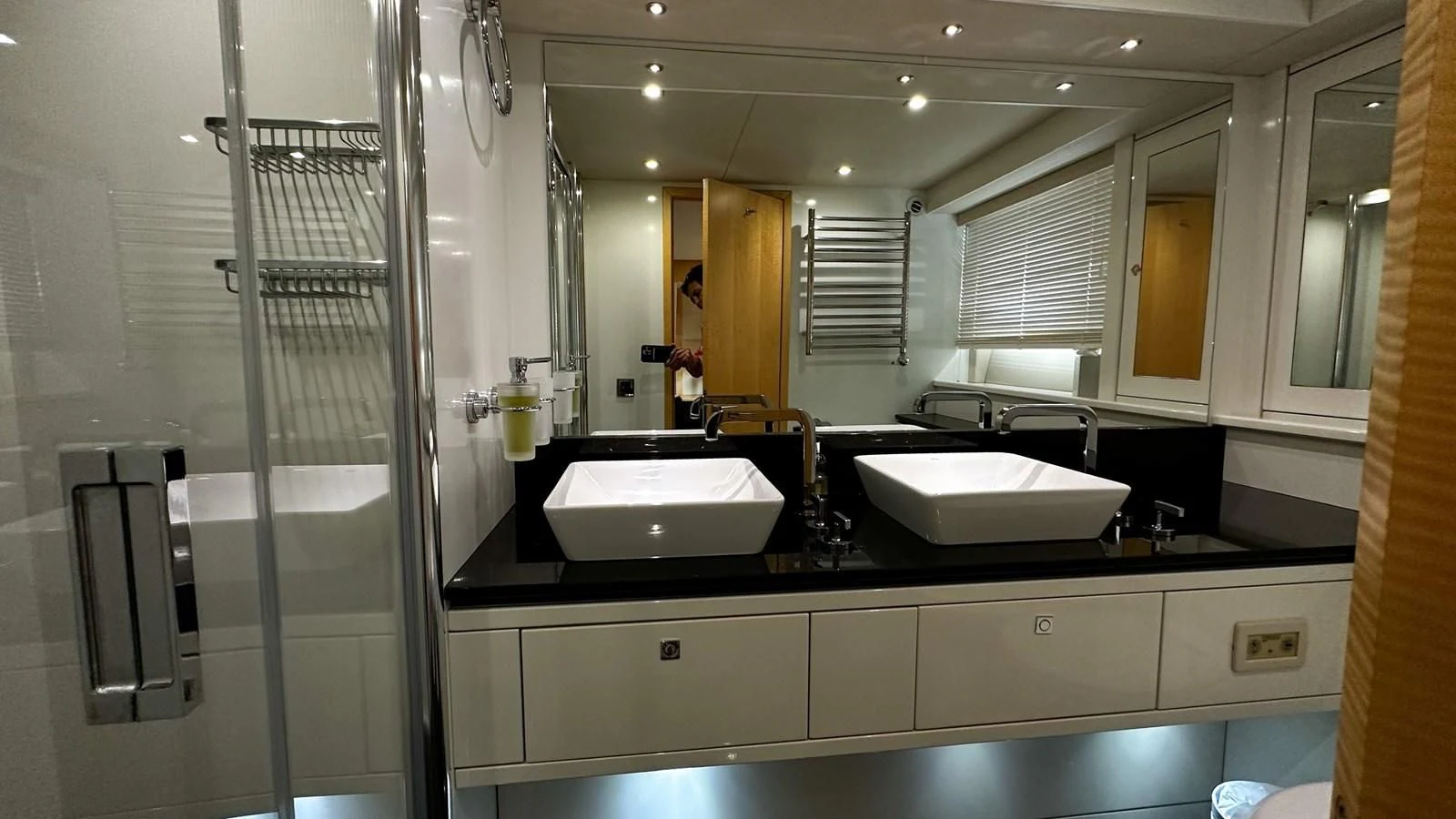a bathroom with sinks and mirrors aboard FUNSEEKER Yacht for Sale