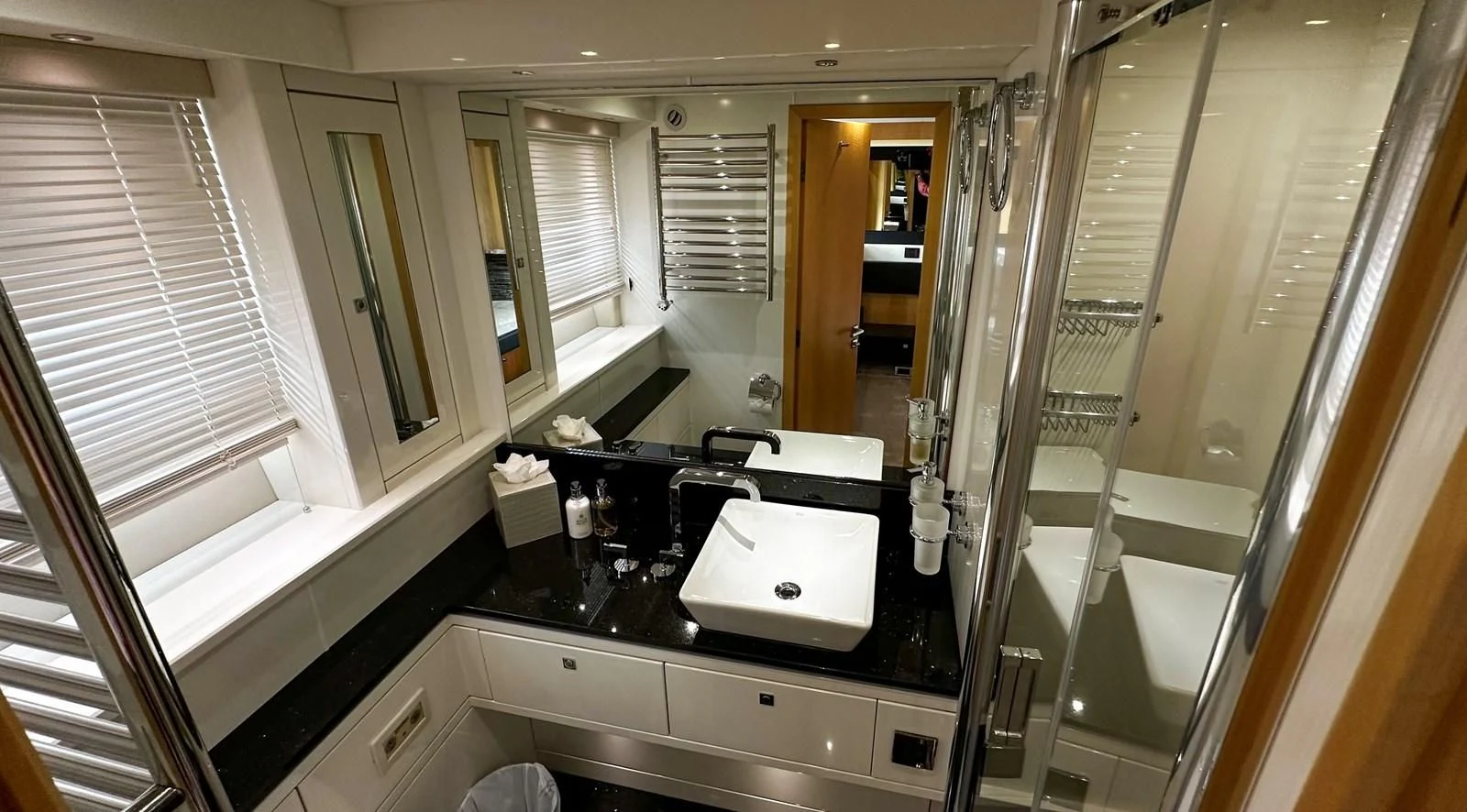 a bathroom with a sink and a mirror aboard FUNSEEKER Yacht for Sale