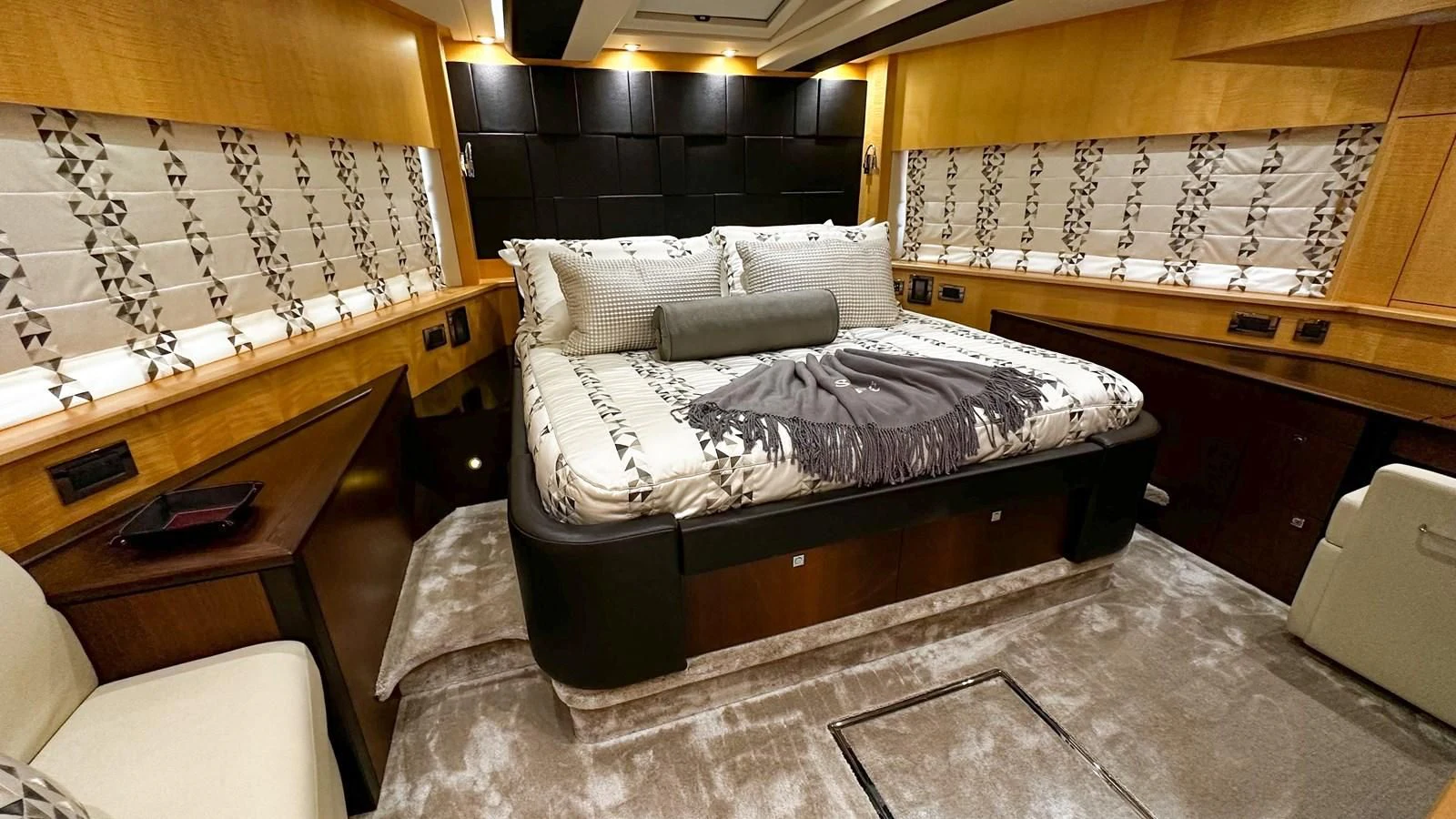 a room with a bed and a desk aboard FUNSEEKER Yacht for Sale