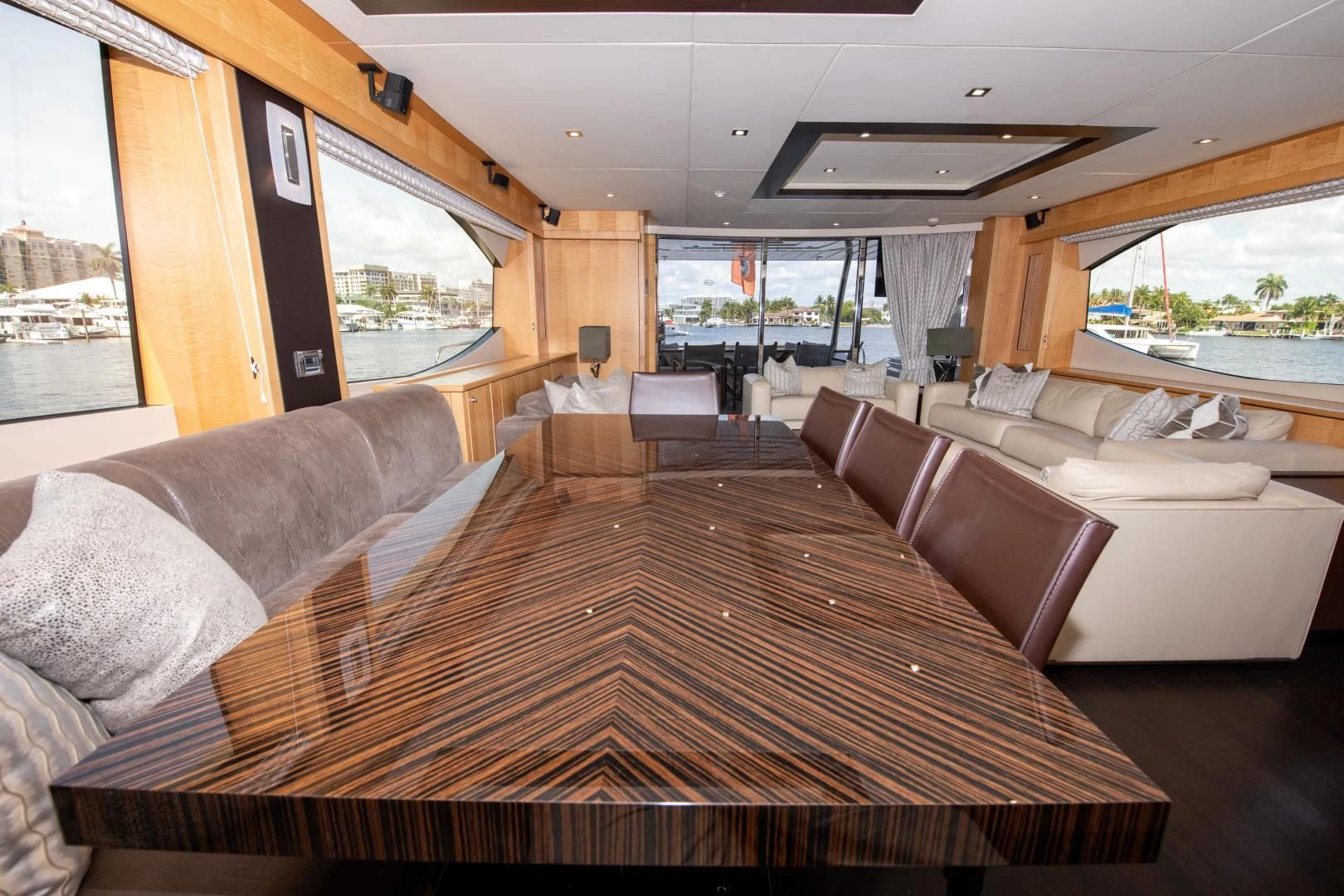 a living room with a wood table aboard FUNSEEKER Yacht for Sale