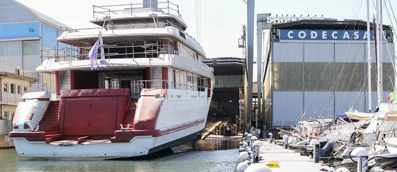 a boat docked in a harbor aboard REGINA D'ITALIA Yacht for Sale