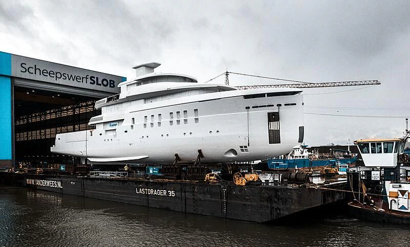 a large cruise ship docked aboard SHINKAI Yacht for Sale