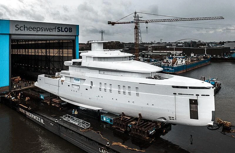 a large white ship docked aboard SHINKAI Yacht for Sale