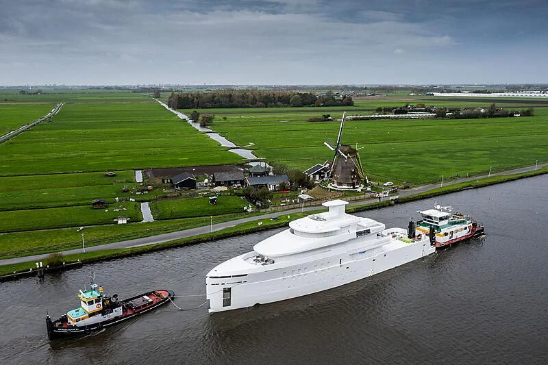 a boat and a helicopter on a river aboard SHINKAI Yacht for Sale