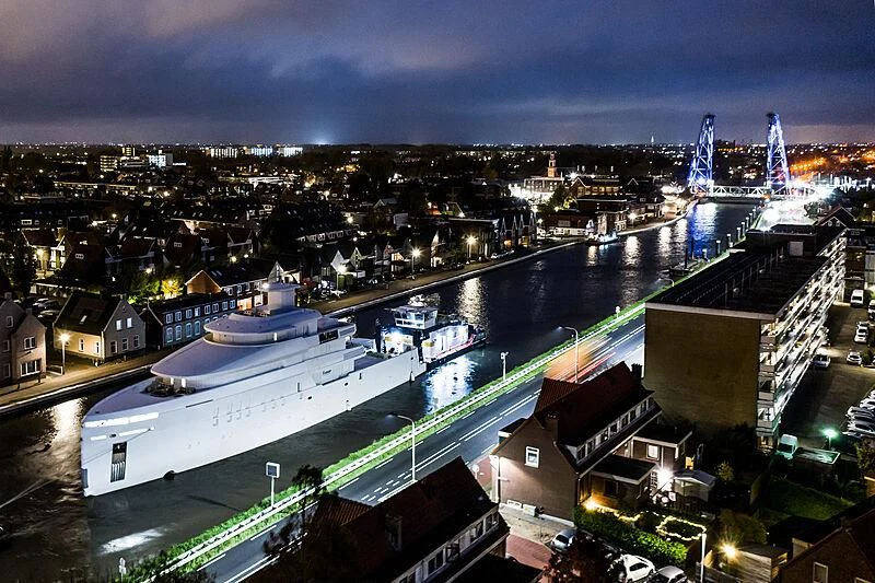 a city with lights at night aboard SHINKAI Yacht for Sale