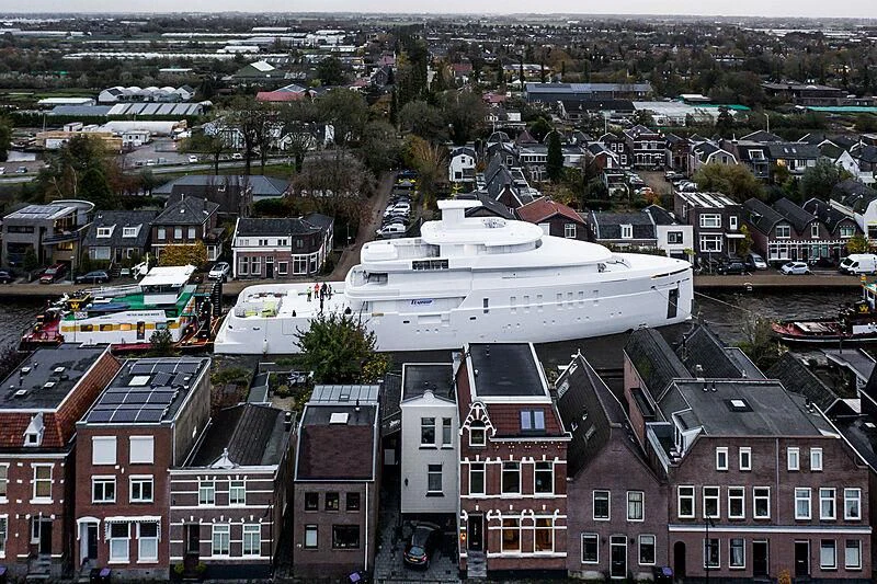 a large white building with red roofs aboard SHINKAI Yacht for Sale