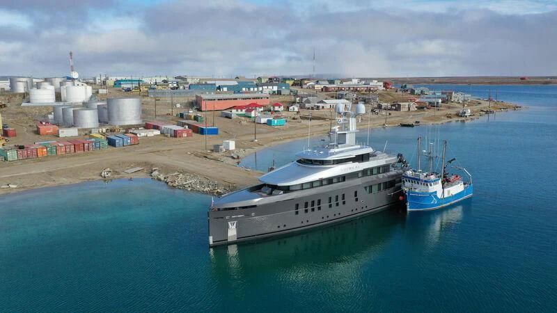 a couple of ships in a harbor aboard SHINKAI Yacht for Sale