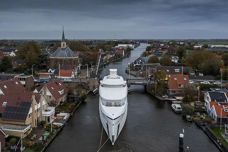 a large white tower in a city aboard SHINKAI Yacht for Sale