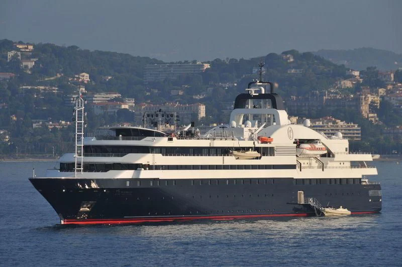 a large ship in the water aboard TURAMA Yacht for Sale
