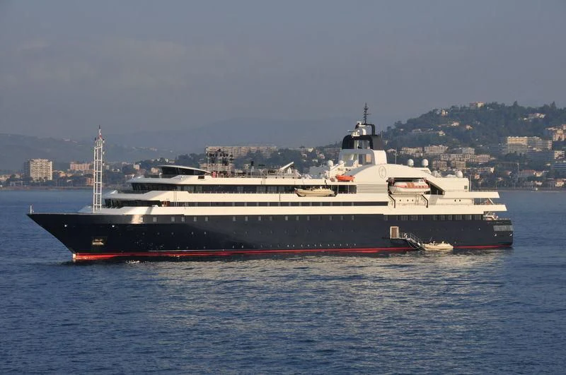 a large ship in the water aboard TURAMA Yacht for Sale
