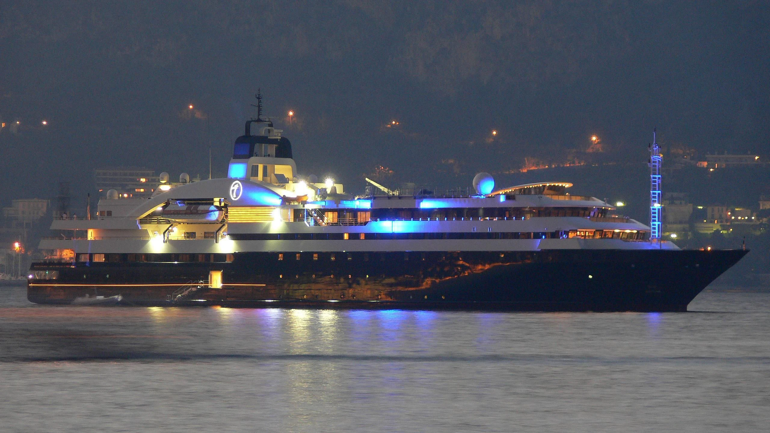 a large ship in the water aboard TURAMA Yacht for Sale