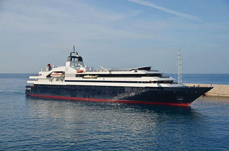 a large ship in the water aboard TURAMA Yacht for Sale
