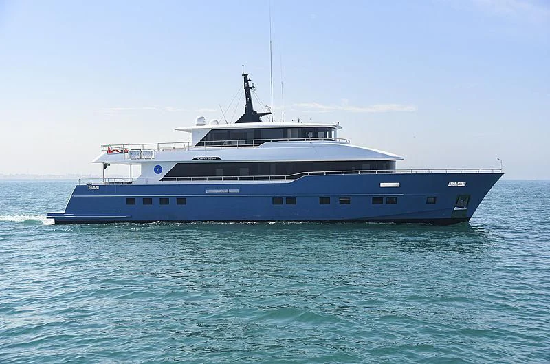 a large boat in the water aboard DIGNITY Yacht for Sale