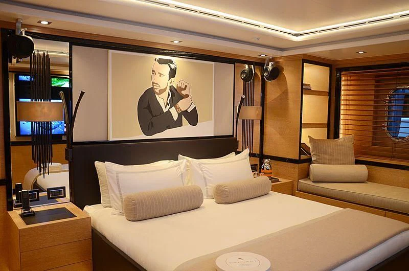 a hotel room with a large bed aboard ALASKA Yacht for Sale