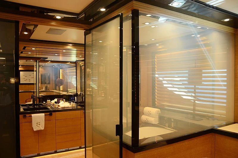 a bathroom with a large glass shower aboard ALASKA Yacht for Sale