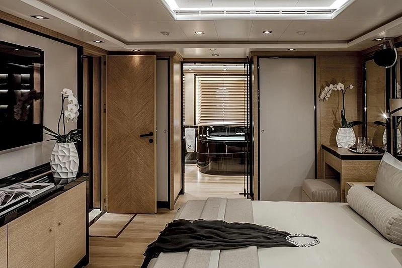 a room with a bed and a desk aboard ALASKA Yacht for Sale
