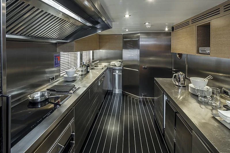 a large kitchen with stainless steel appliances aboard ALASKA Yacht for Sale