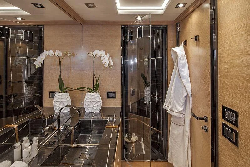 a large bathroom with a glass display aboard ALASKA Yacht for Sale