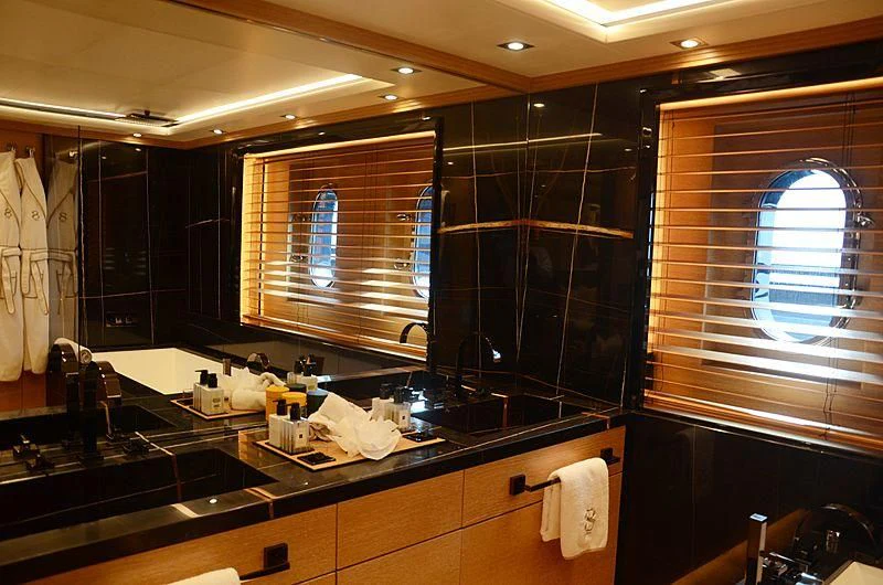 a bathroom with a large mirror aboard ALASKA Yacht for Sale