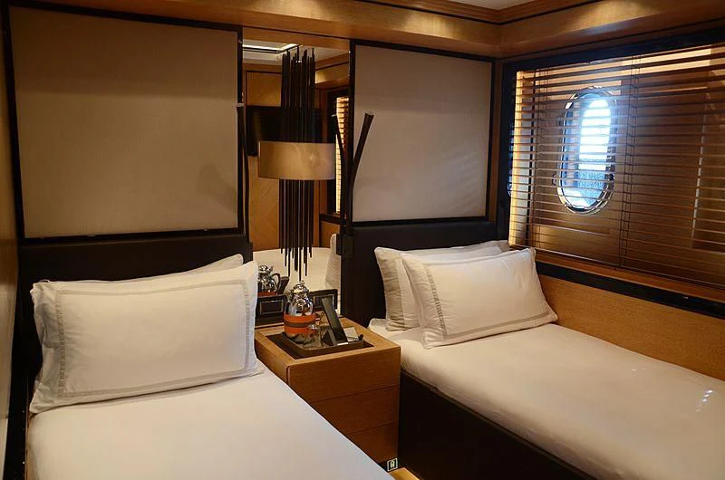 a room with two beds aboard ALASKA Yacht for Sale