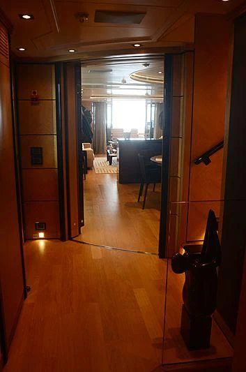 a hallway with a glass door aboard ALASKA Yacht for Sale