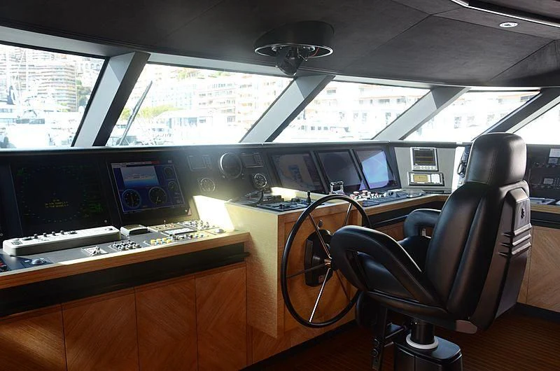 a room with computers and monitors aboard ALASKA Yacht for Sale