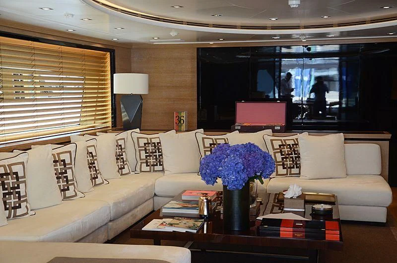 a living room with a couch and a coffee table aboard ALASKA Yacht for Sale