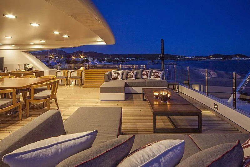 a patio with a table and chairs aboard ALASKA Yacht for Sale