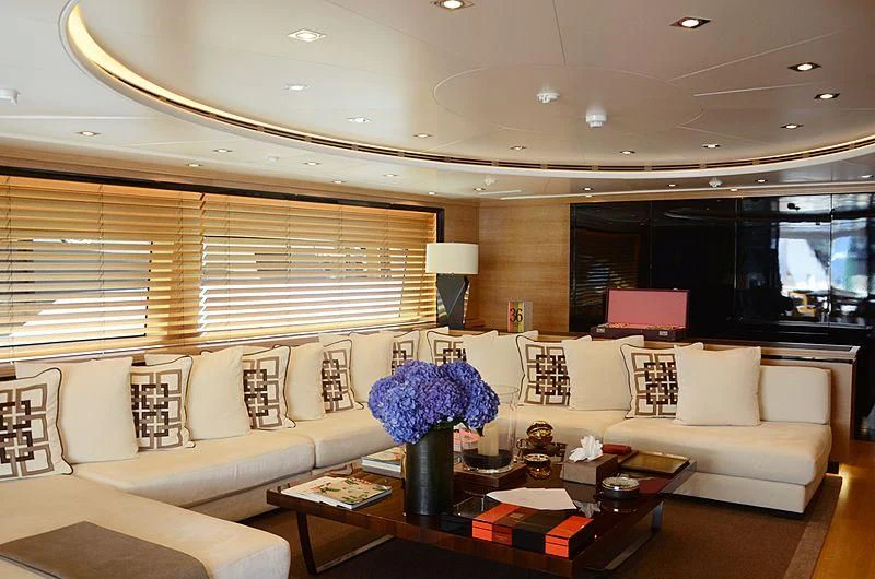 a living room with a white couch and a coffee table aboard ALASKA Yacht for Sale