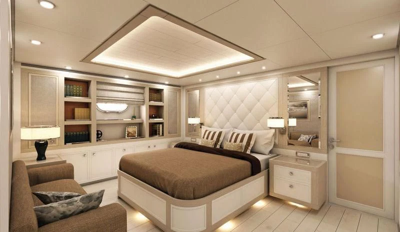 a bedroom with a bed and a couch aboard GIO CHI THE Yacht for Sale