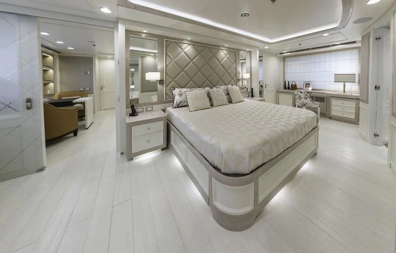 a large bedroom with a large bed aboard GIO CHI THE Yacht for Sale