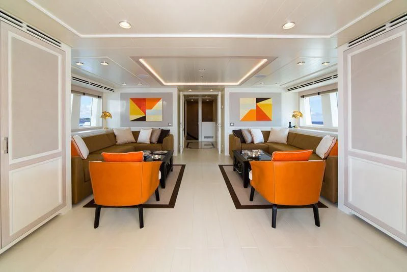 a living room with a couch and a chair aboard GIO CHI THE Yacht for Sale