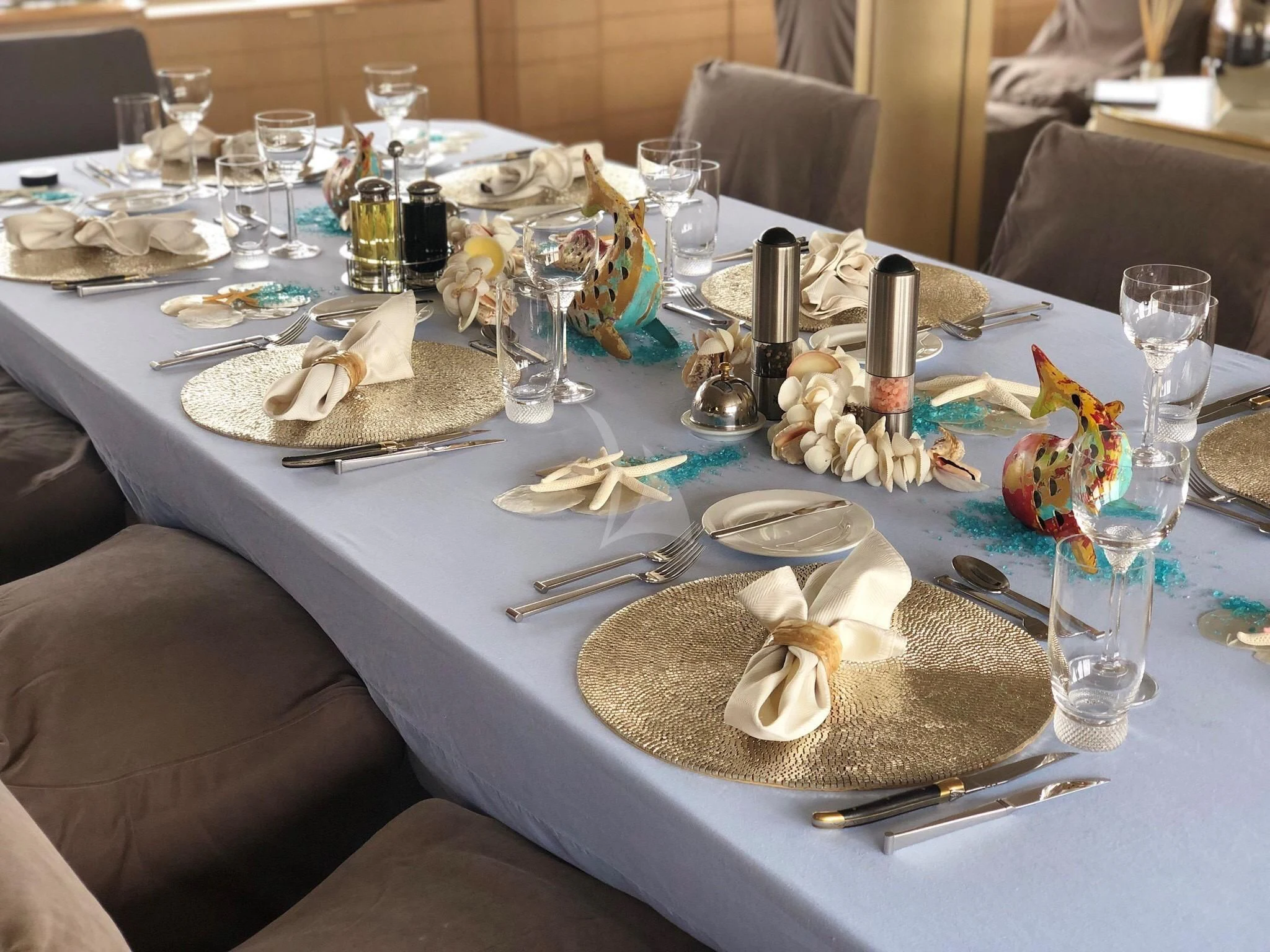 a table with plates and silverware aboard AZZURRA II Yacht for Sale