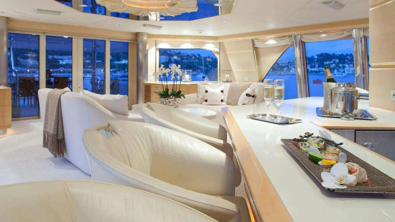 a room with a table chairs and a large window aboard AZZURRA II Yacht for Sale
