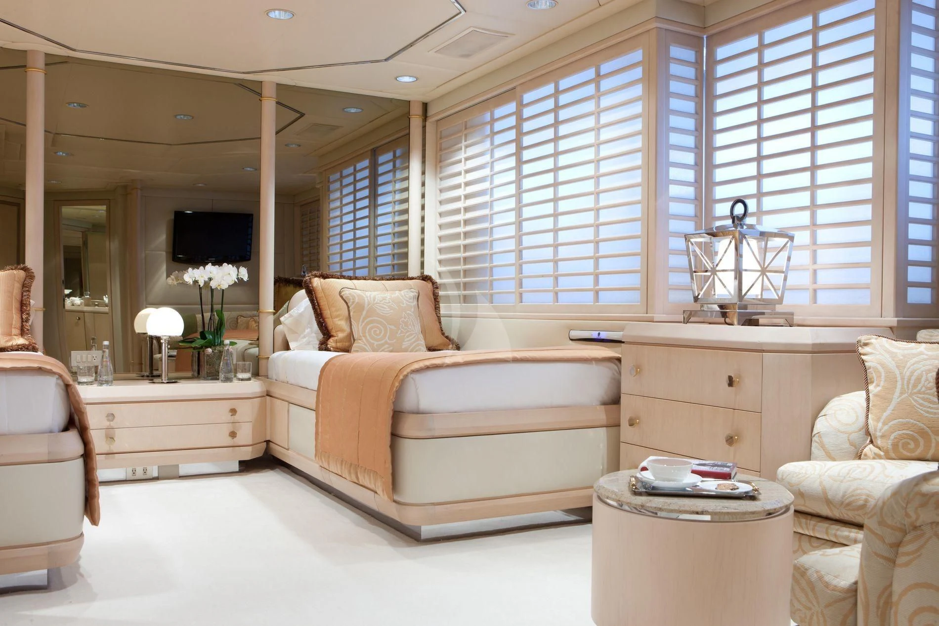 a large bedroom with a large mirror aboard AZZURRA II Yacht for Sale