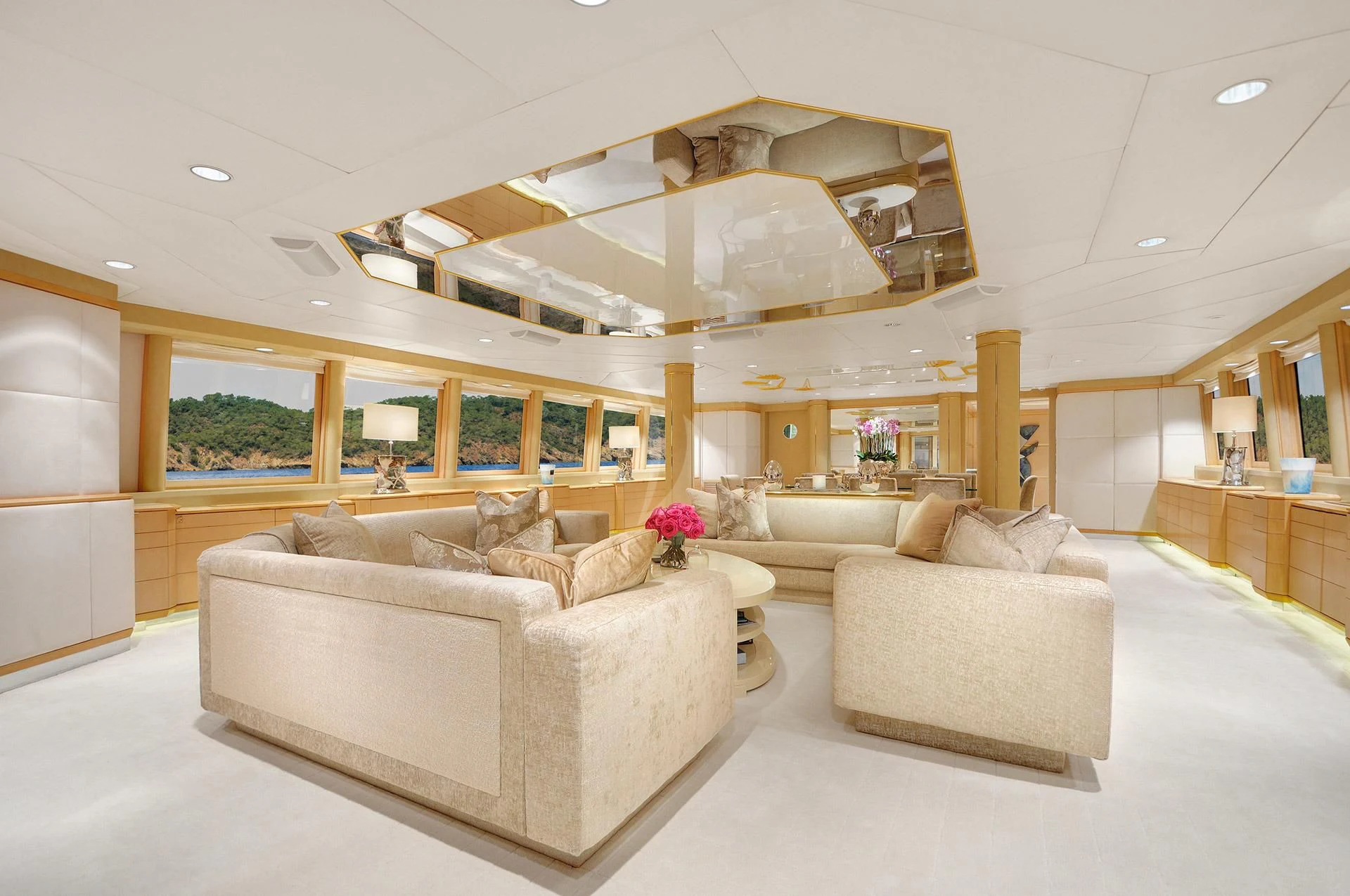 a living room with a large white couch and a large ceiling aboard AZZURRA II Yacht for Sale