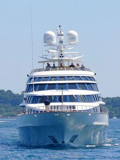 a large white boat with people on it aboard AZZURRA II Yacht for Sale