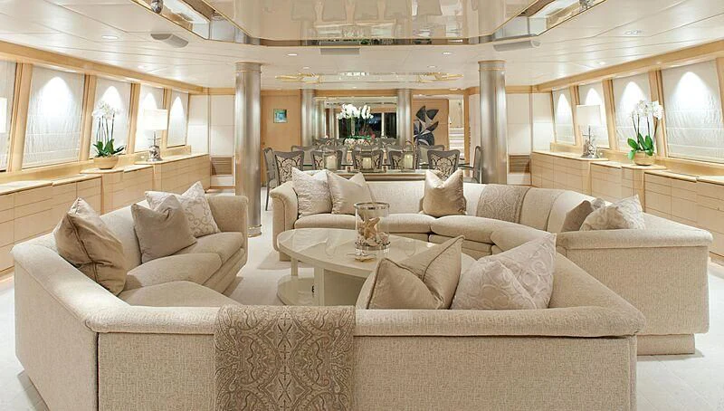 a living room with couches and a coffee table aboard AZZURRA II Yacht for Sale