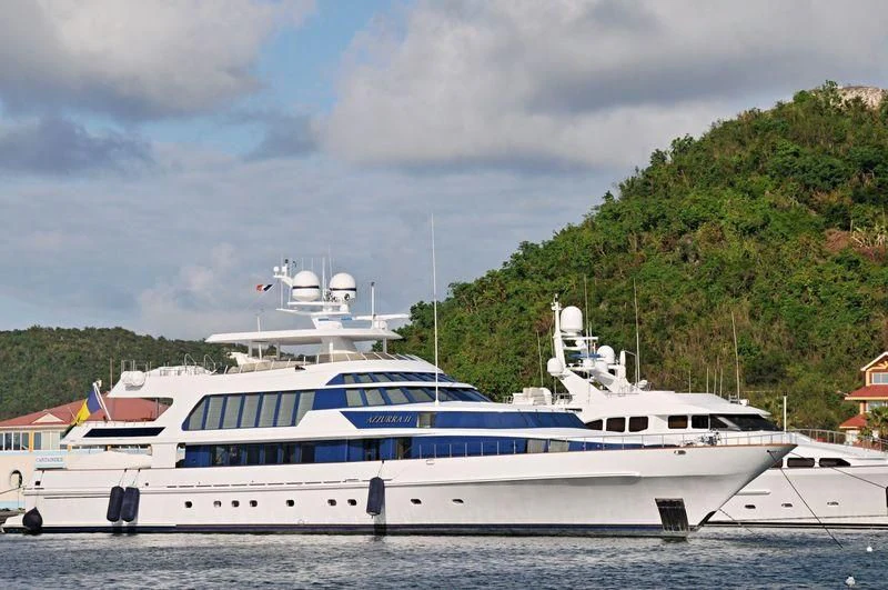a couple of large white boats in a harbor aboard AZZURRA II Yacht for Sale