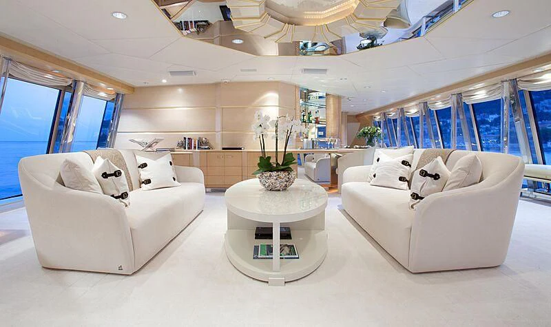 a living room with a white couch and a coffee table aboard AZZURRA II Yacht for Sale