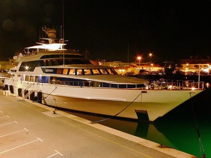a large boat in a harbor aboard AZZURRA II Yacht for Sale