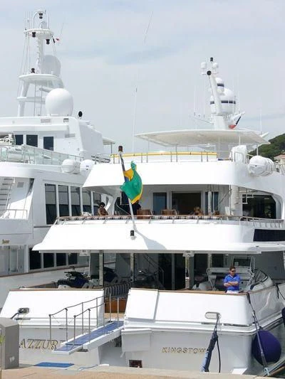 a boat with flags on it aboard AZZURRA II Yacht for Sale