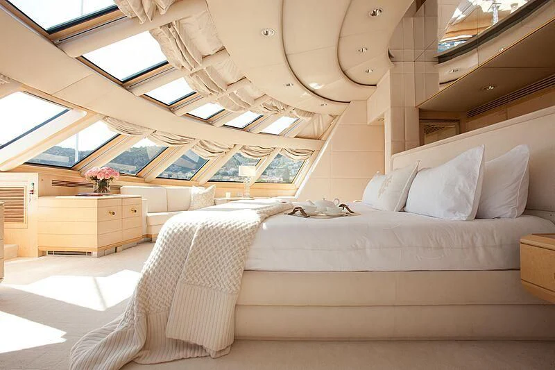 a room with a bed and a desk aboard AZZURRA II Yacht for Sale