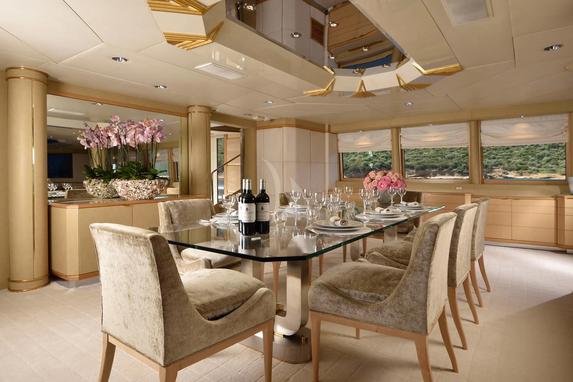 a large kitchen with a table and chairs aboard AZZURRA II Yacht for Sale