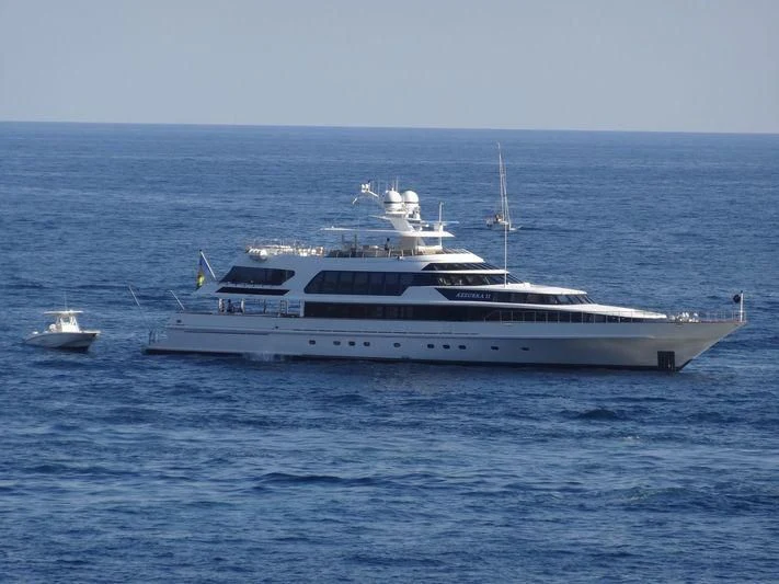 a white yacht in the water aboard AZZURRA II Yacht for Sale