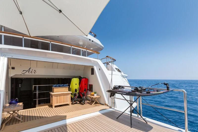 a boat docked at a pier aboard AIR Yacht for Sale