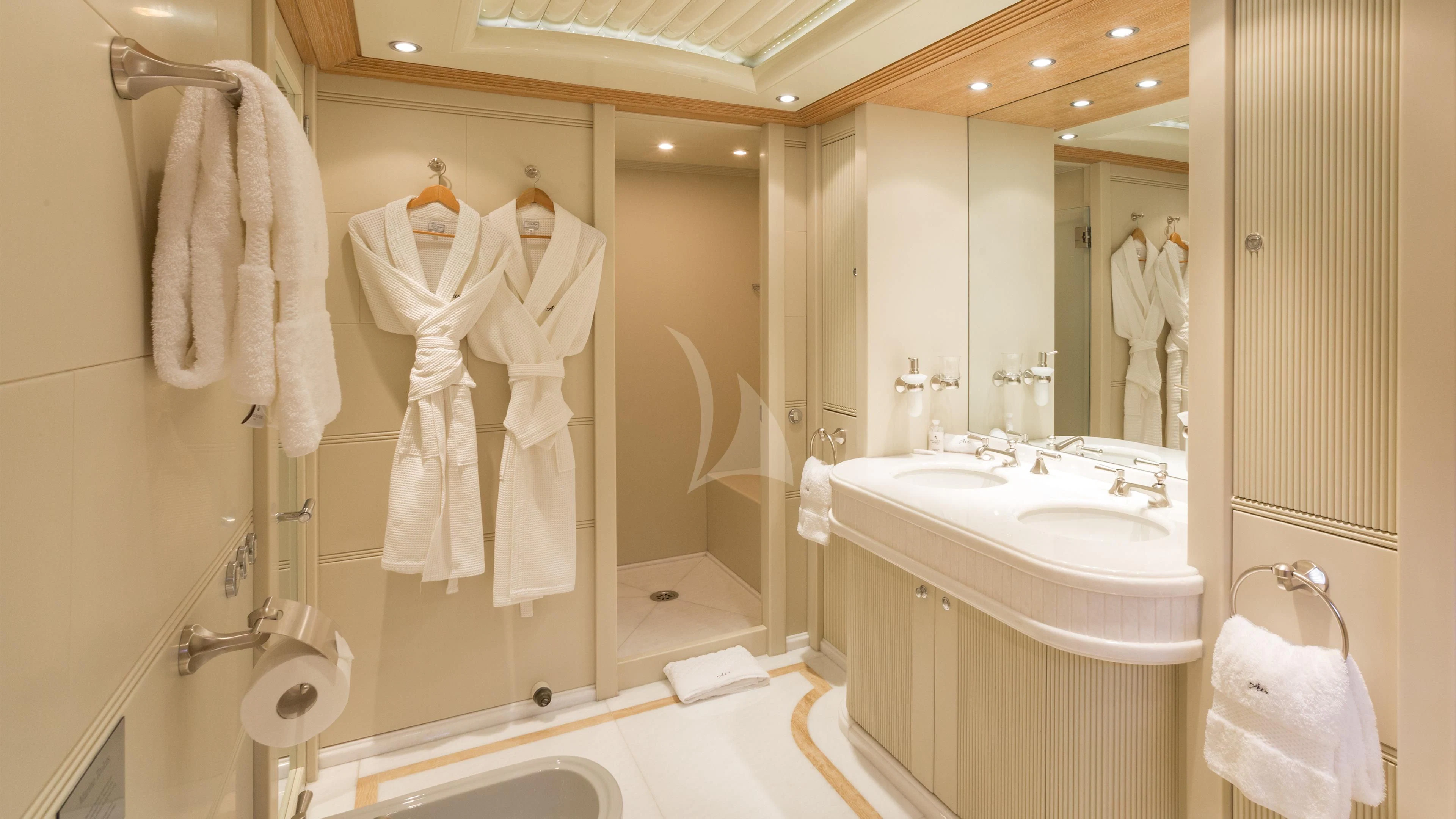 a bathroom with a large mirror aboard AIR Yacht for Sale