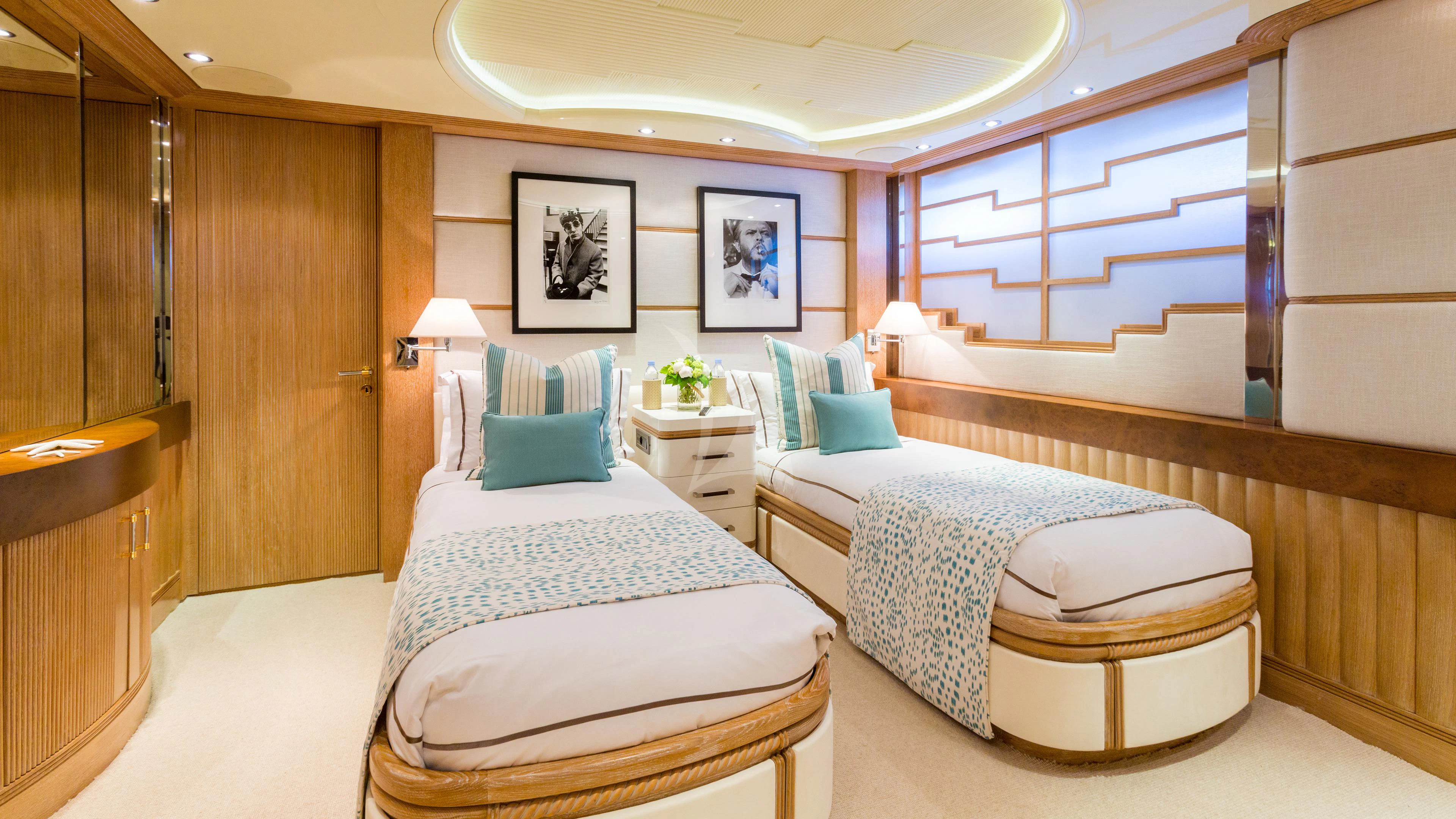 a room with two beds aboard AIR Yacht for Sale