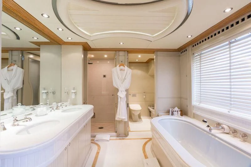 a bathroom with a bathtub sink and toilet aboard AIR Yacht for Sale
