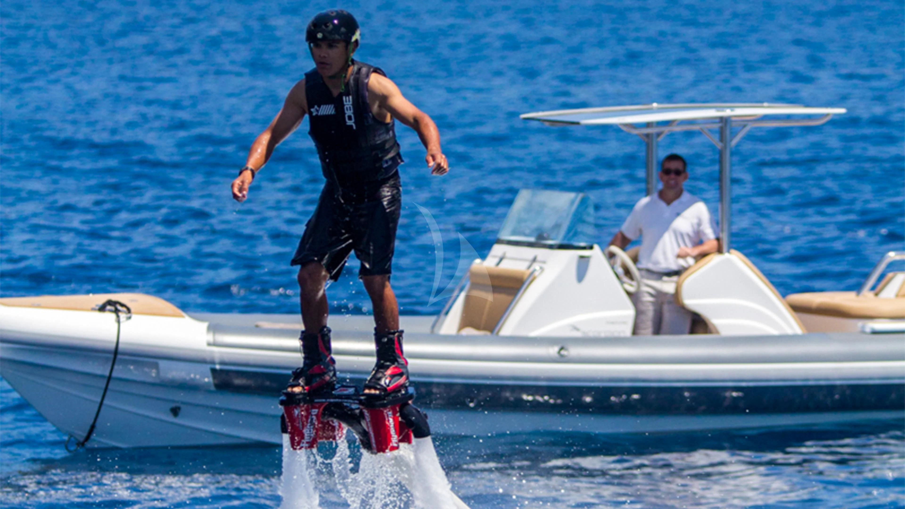 a man walking on a boat aboard AIR Yacht for Sale